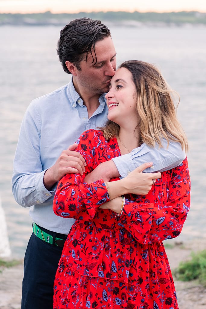 candid moment of couple after castle hill lighthouse proposal