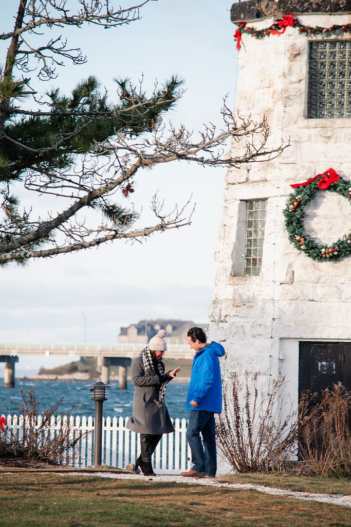 couple smiles after proposal in newport ri