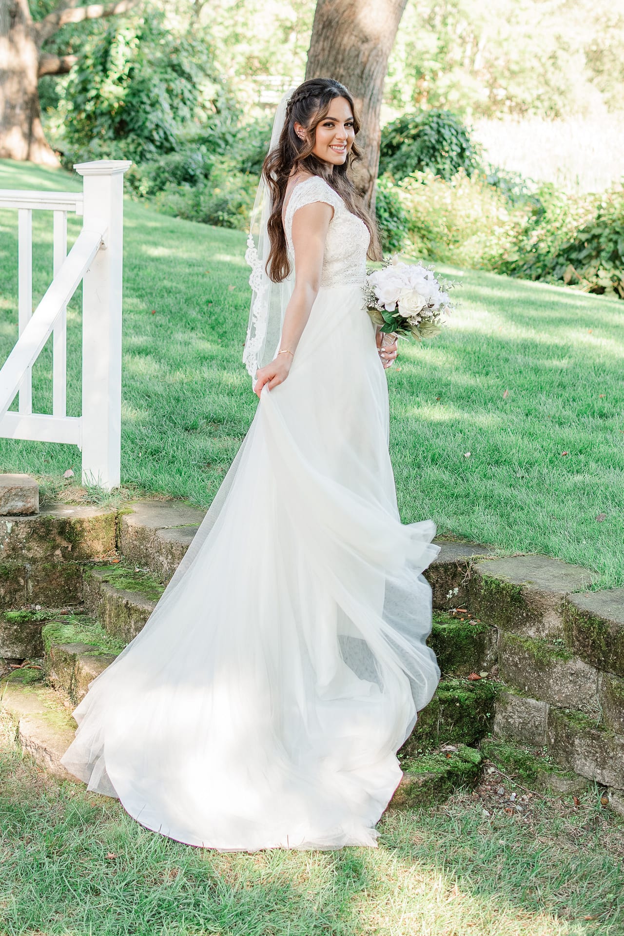 bride swishes dress for photographer in rhode island