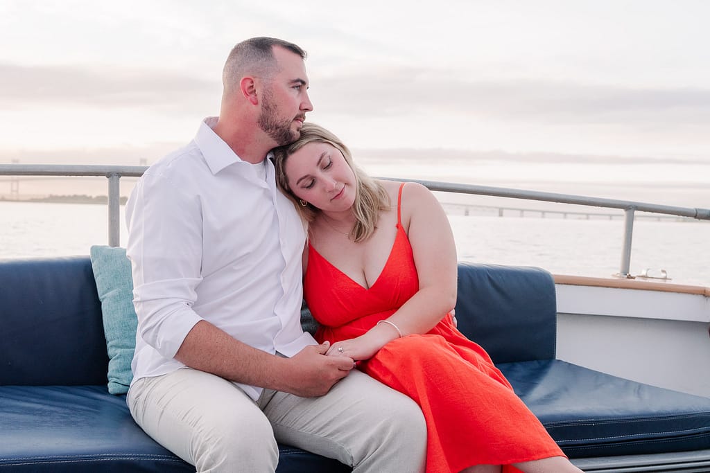couple relaxes on newport harbor tour