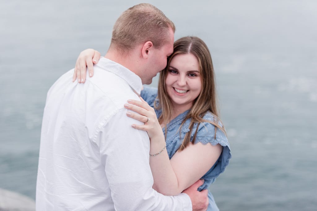 couple smiles after rhode island surprise engagement