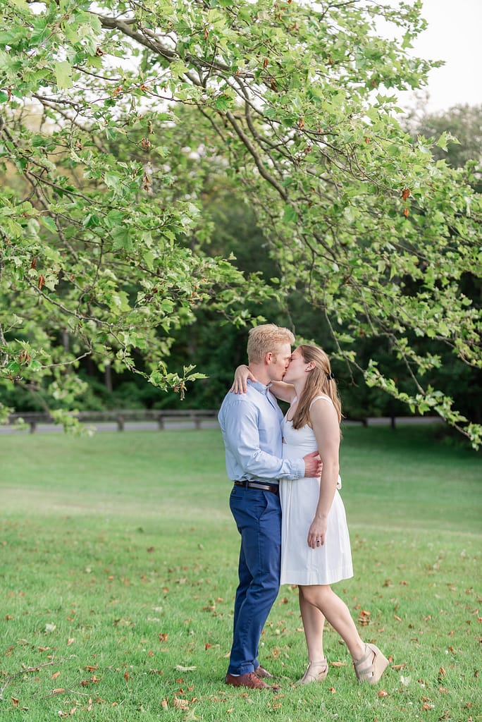 couple kisses under tree at colt state park