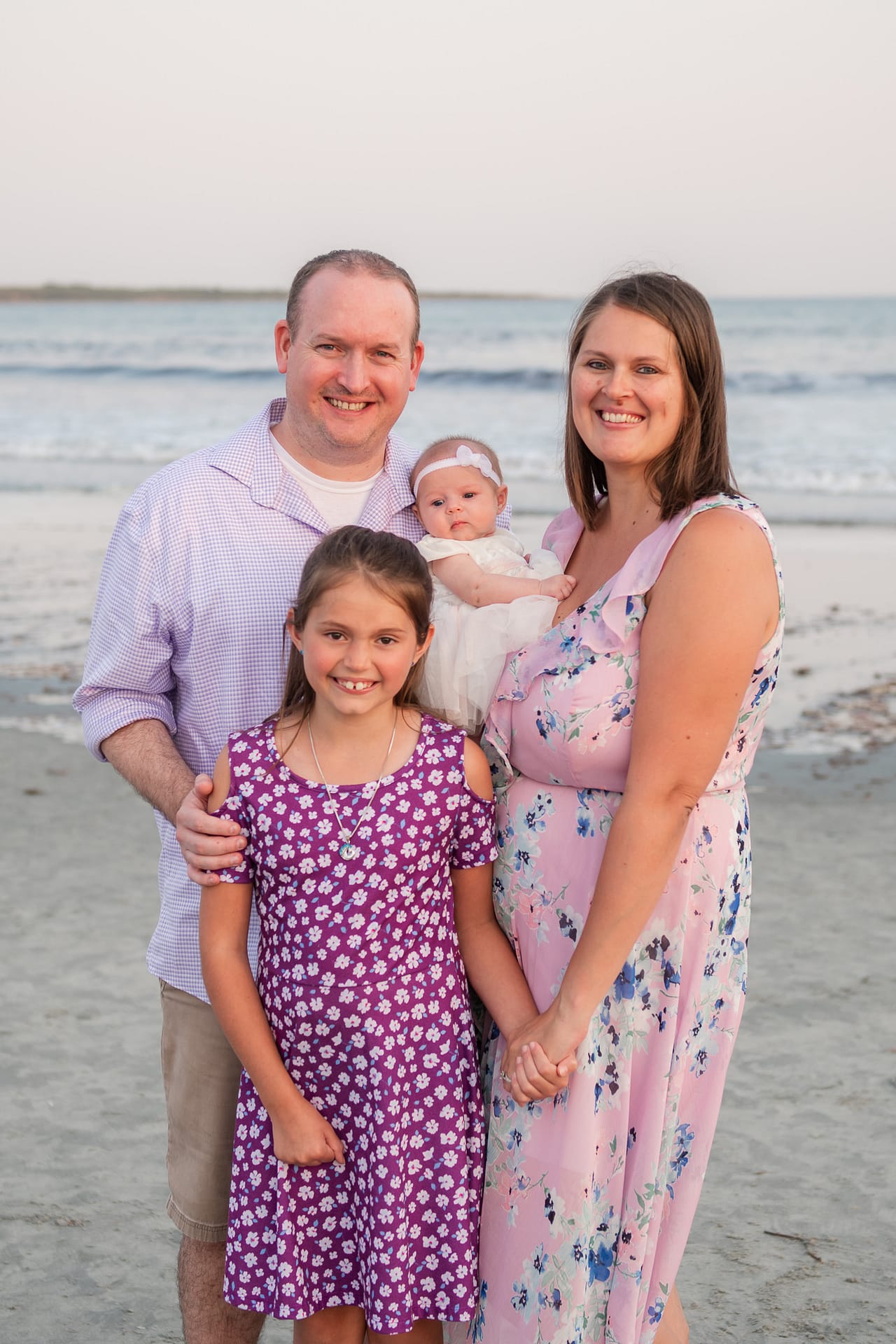 family wearing purple for portraits in newport