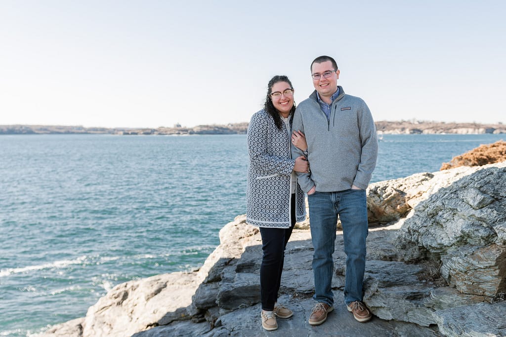 couple smiles after engagement in newport