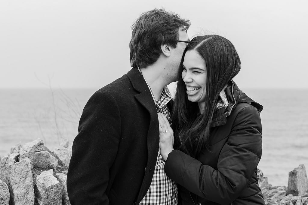 couple laughs after cliff walk proposal