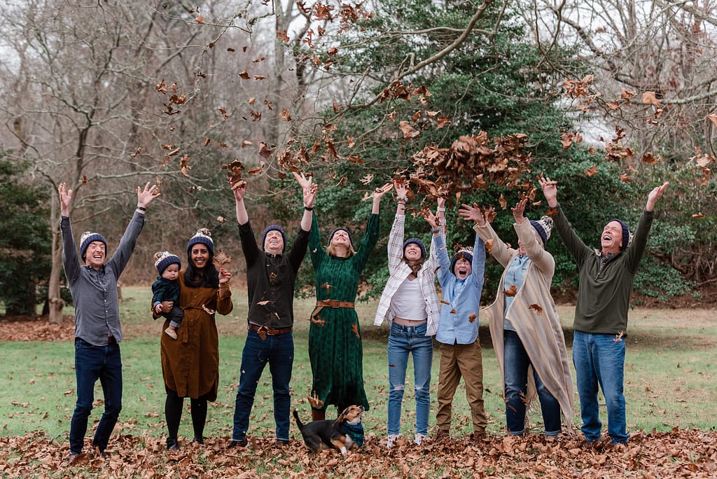 family throws leaves up in the air as ideas for christmas family photos