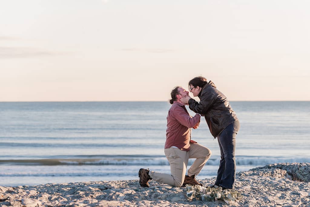 winter marriage proposal at the beach
