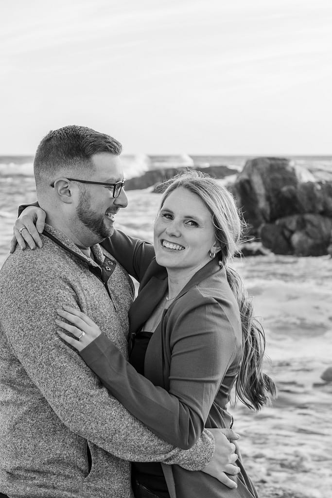couple smiles after newport surprise engagement