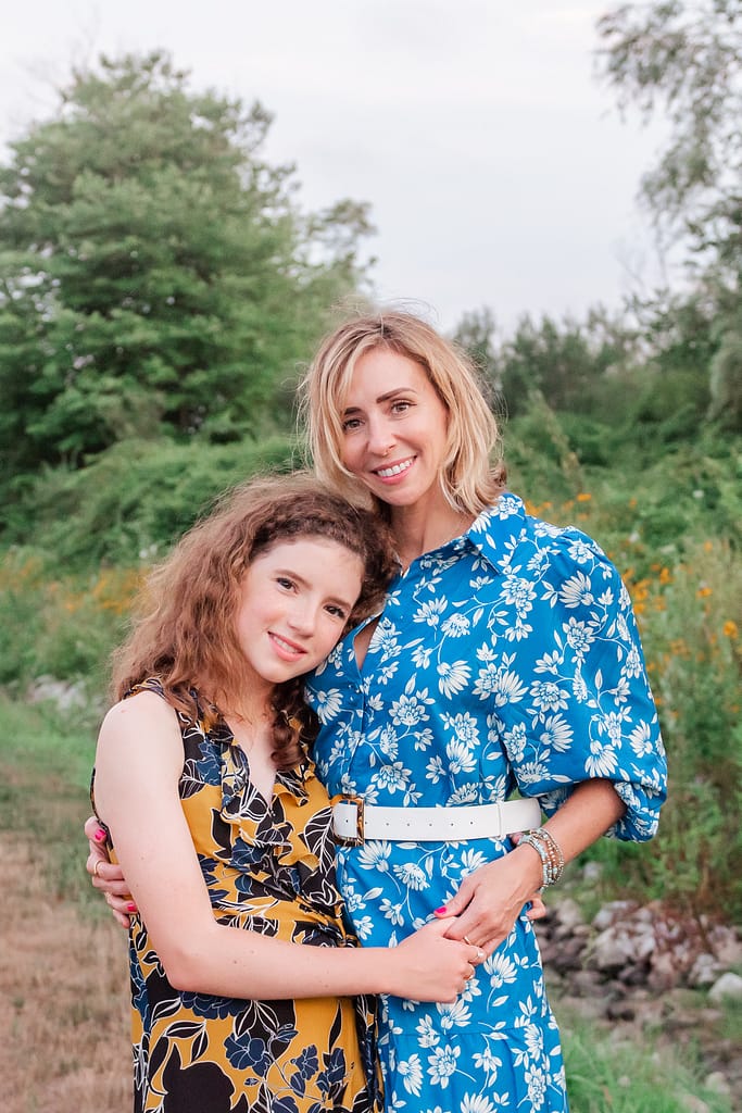 mom and daughter in a field