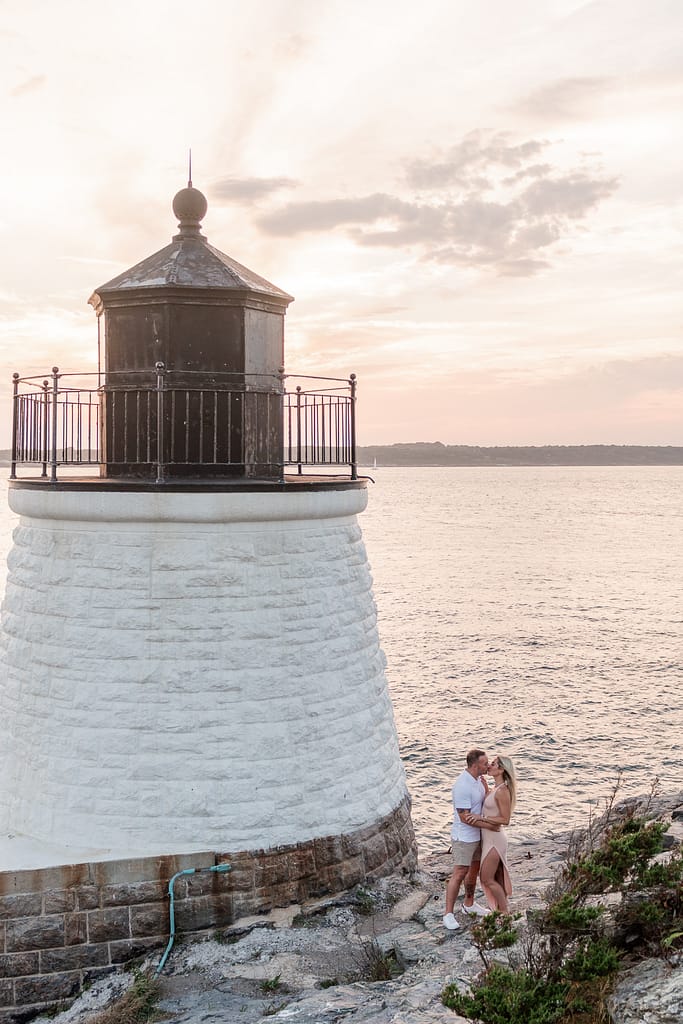 couple stands near castle hill lighthouse