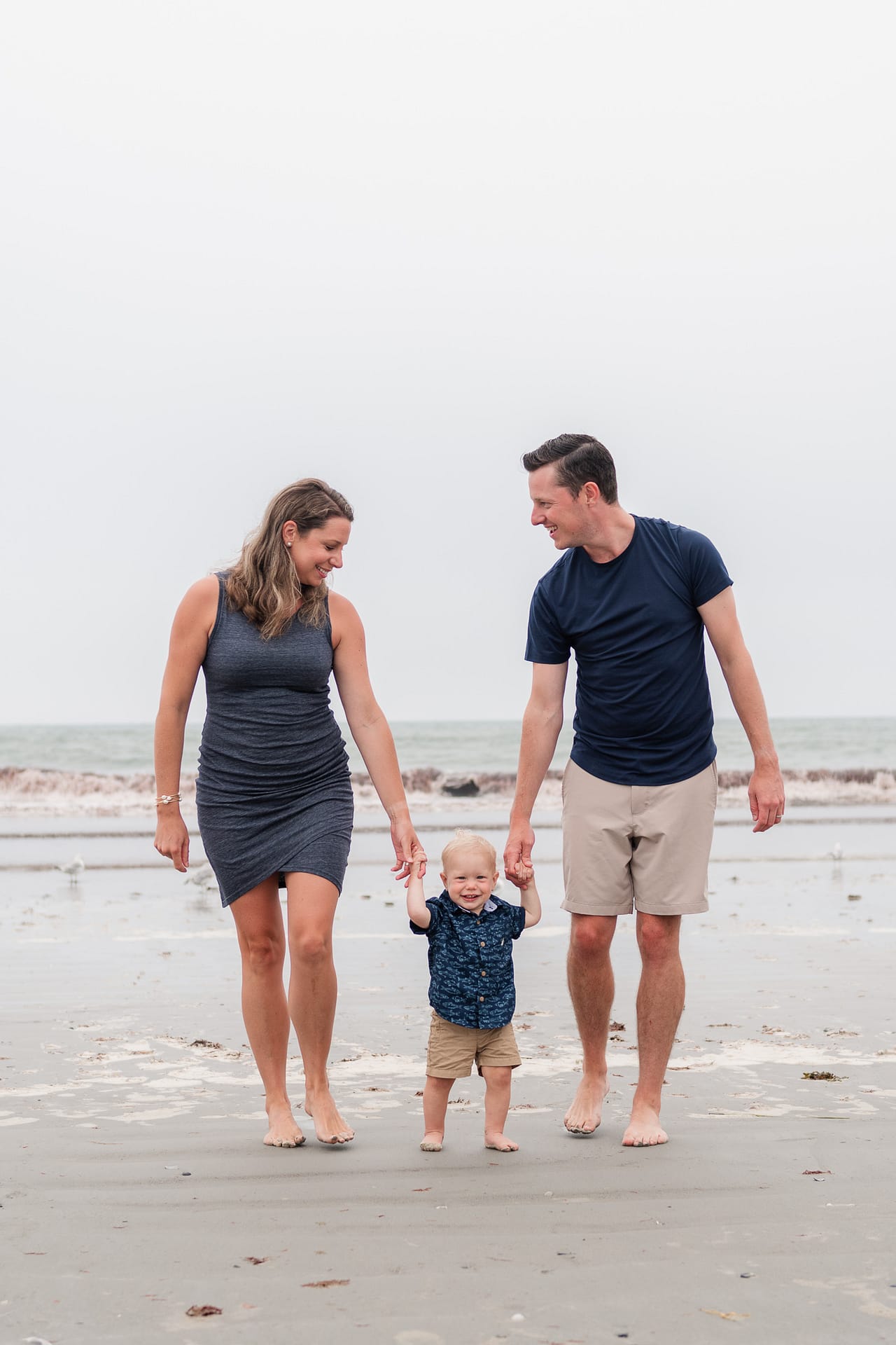 family photographer in newport captures moment on the beach